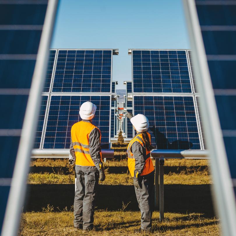 two solar energy workers
