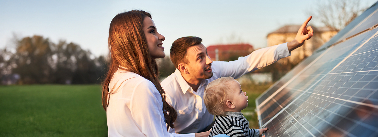Family looking at their installed solar panels