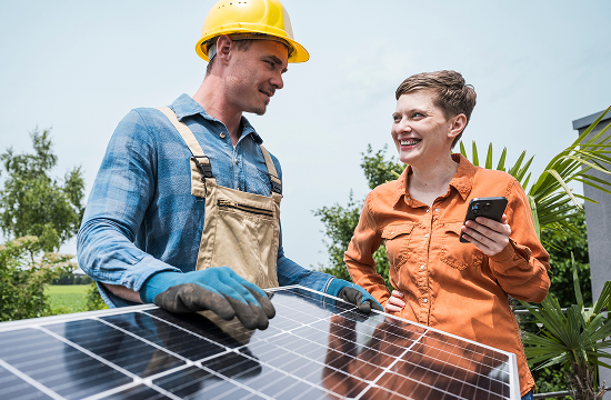 Home owner discussing solar with technician