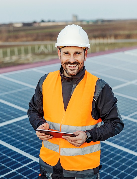 Happy solar technician at jobsite